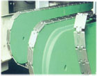 Chain tensioners and Supporting elements in a conveyor system